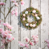 Paaskrans met bloemen en eieren, decoratieve tafelkrans, deurkrans met ophanghaak. Translation: Paaswreath met bloemen en eieren, decoratieve tafelwreath, deurwreath met ophanghaak.