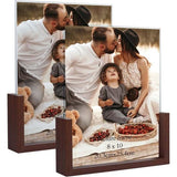 Dubbelzijdige fotolijst 20 x 25 cm van glas met een bruine houten onderlegger voor tafelblad, set van 2