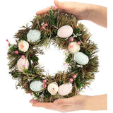 Paaskrans met bloemen en eieren, decoratieve tafelkrans, deurkrans met ophanghaak. Translation: Paaswreath met bloemen en eieren, decoratieve tafelwreath, deurwreath met ophanghaak.